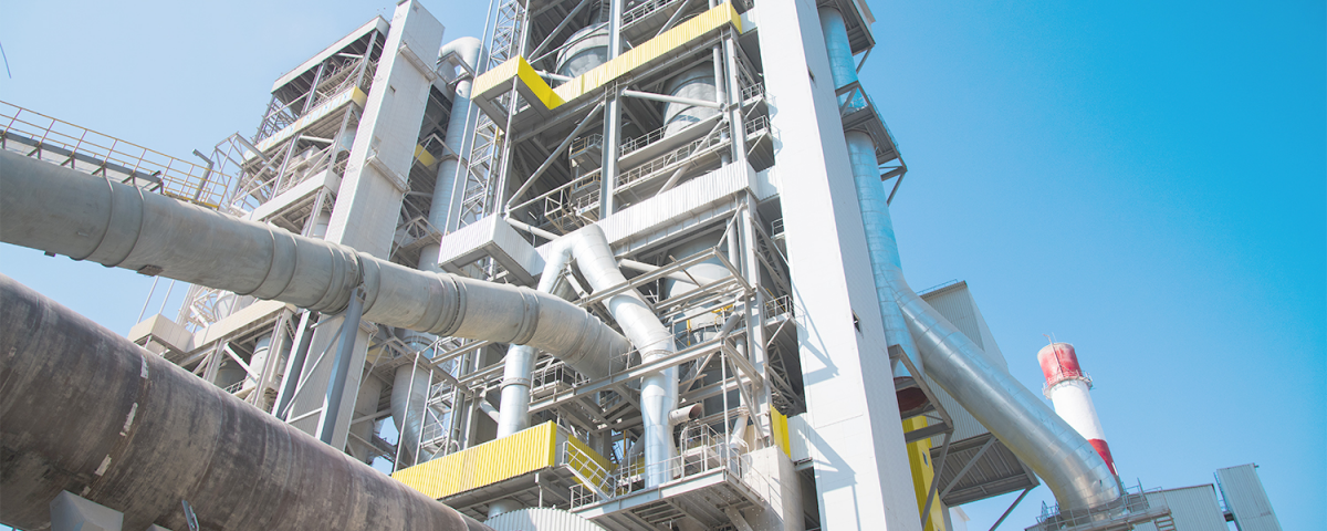 Industrial processing plant under a clear blue sky